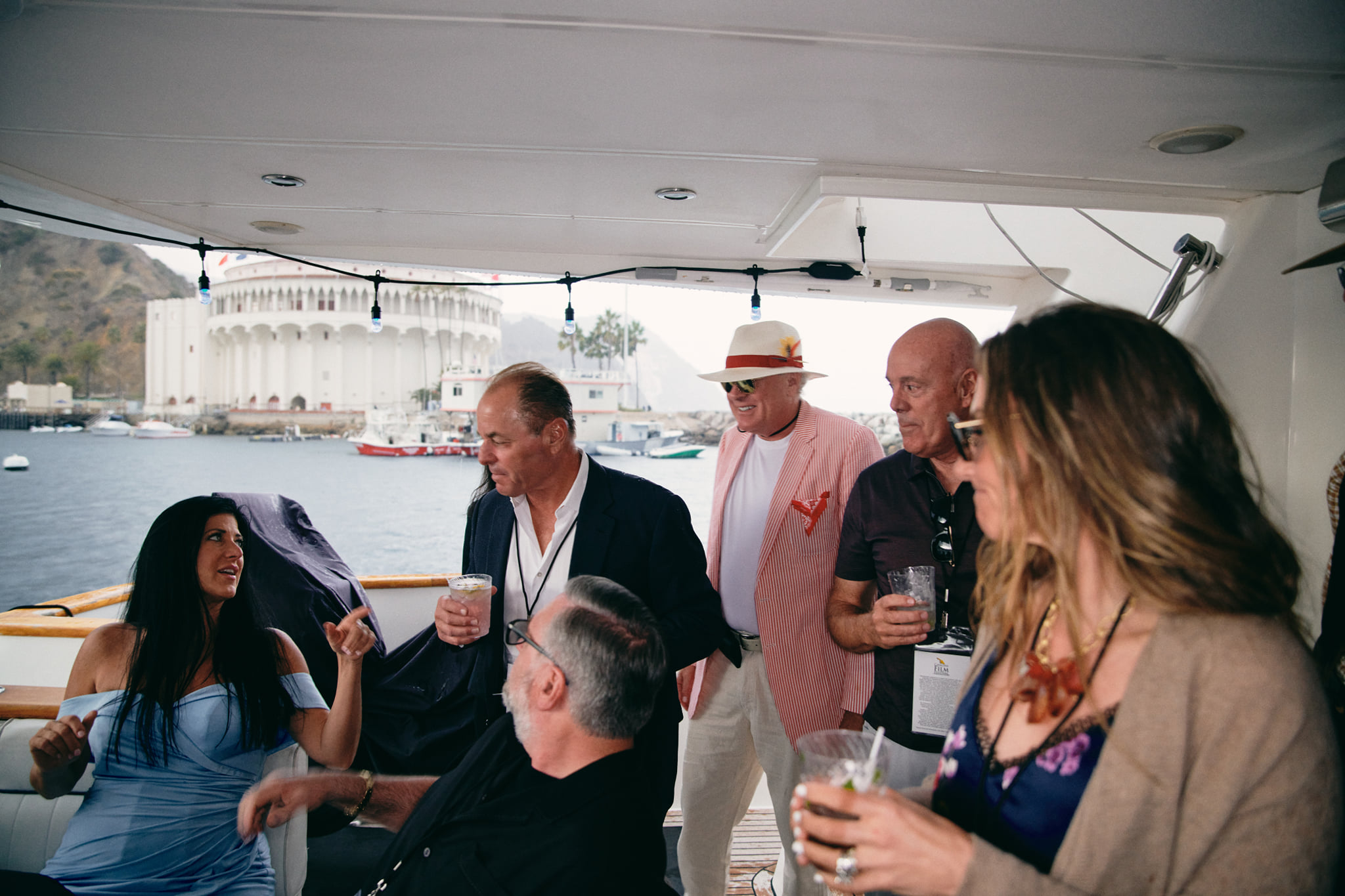 Guests enjoying a festival on a yacht in Catalina harbor